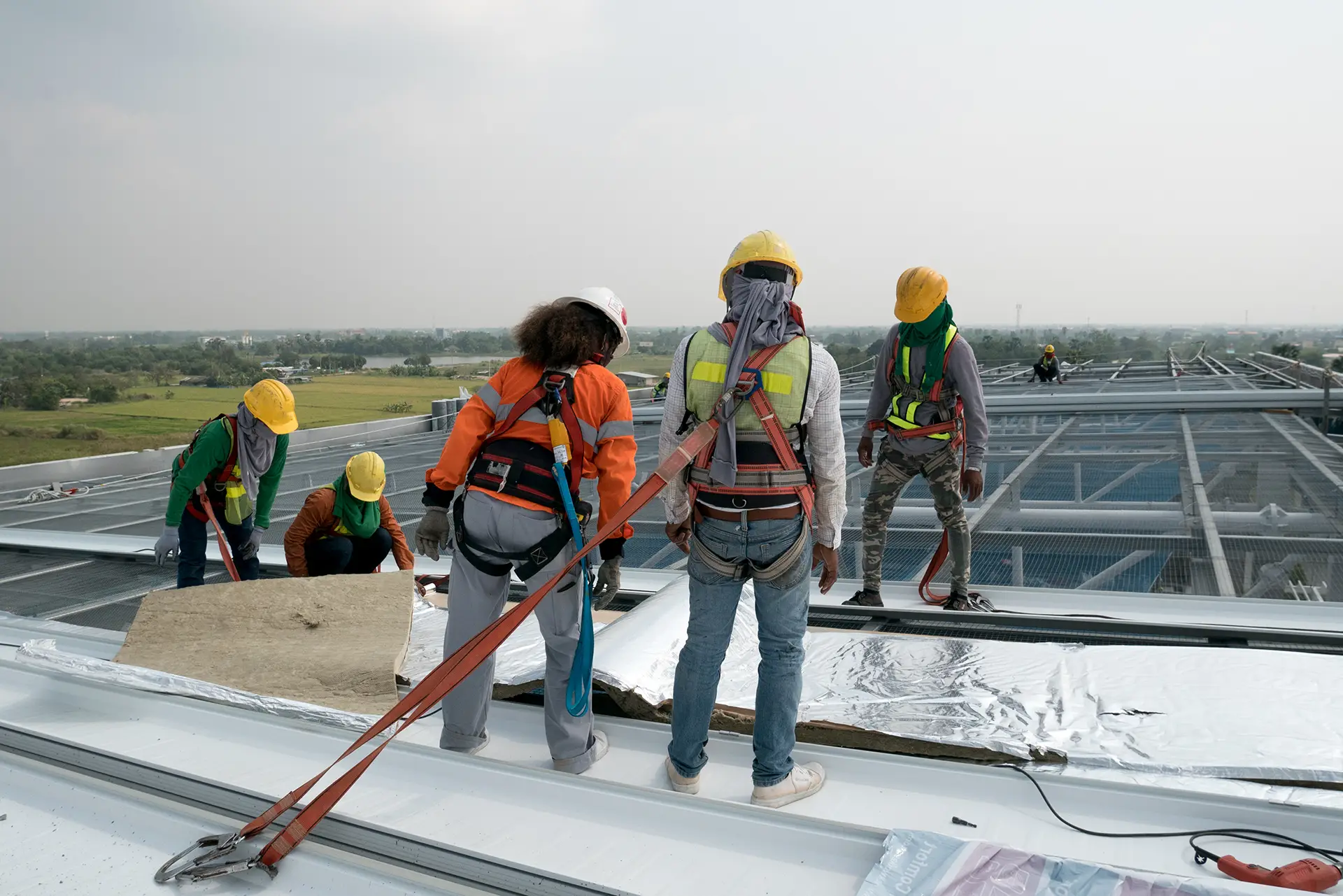 Workers performing roof maintenance