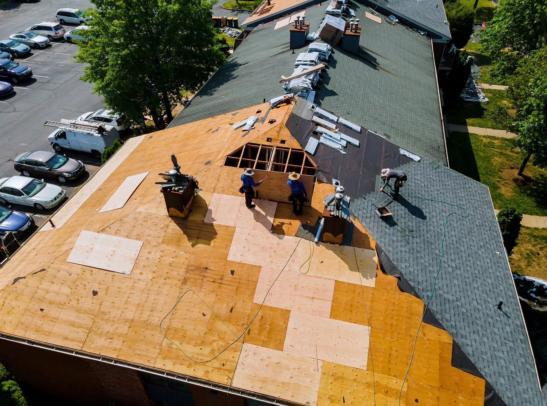 workers performing residential roofing replacement
