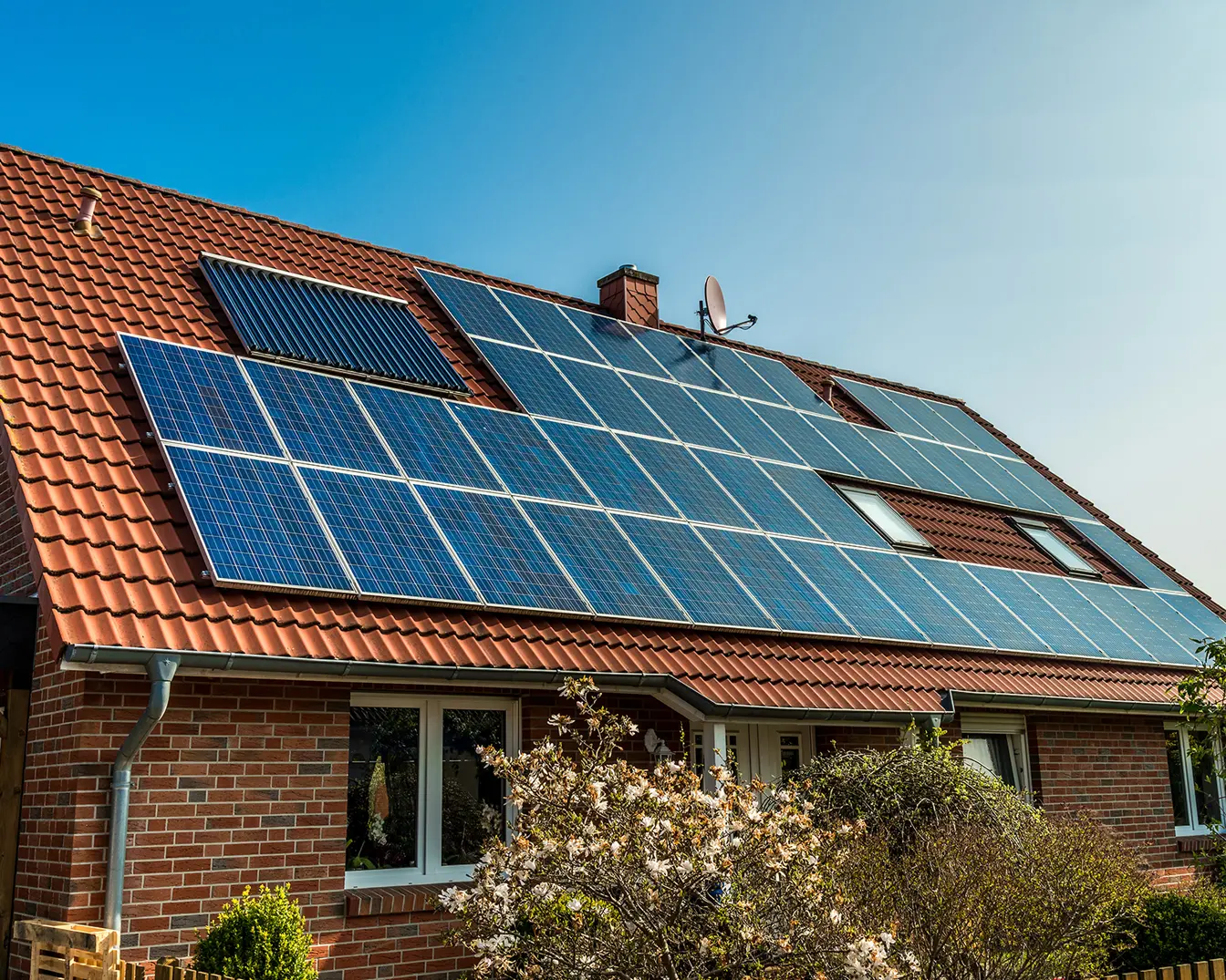 Residential house with solar panels on roof